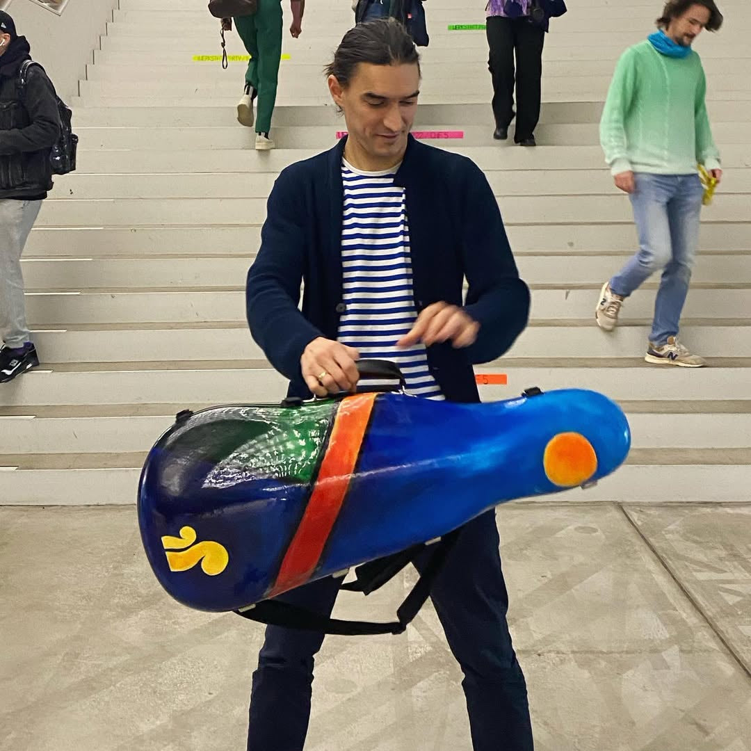 Sergey Malov hodling his Violoncello da Spalla case