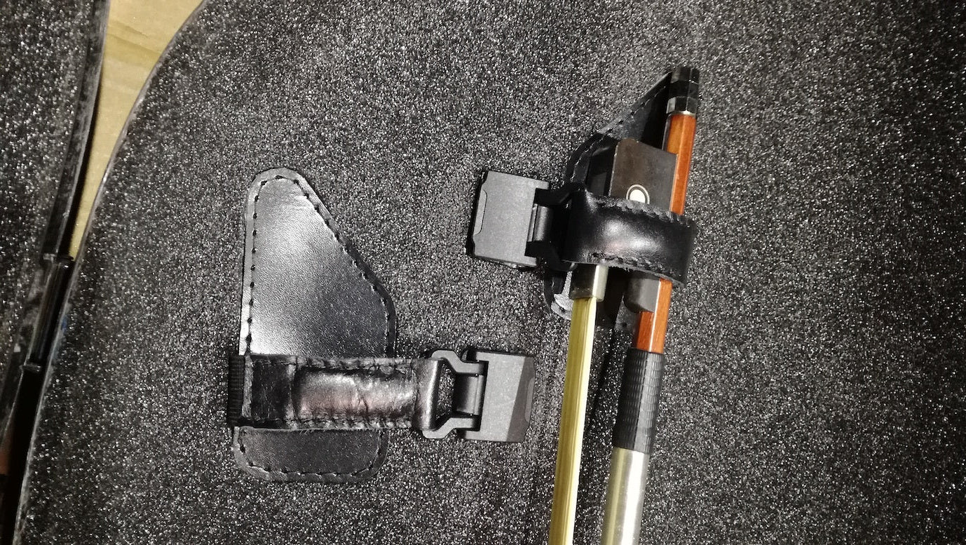 Bow holder with a black leather quiver in a cello case