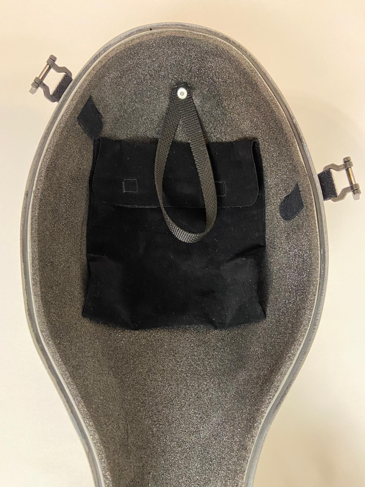 Black removable pouch inside a carbon fiber cello case